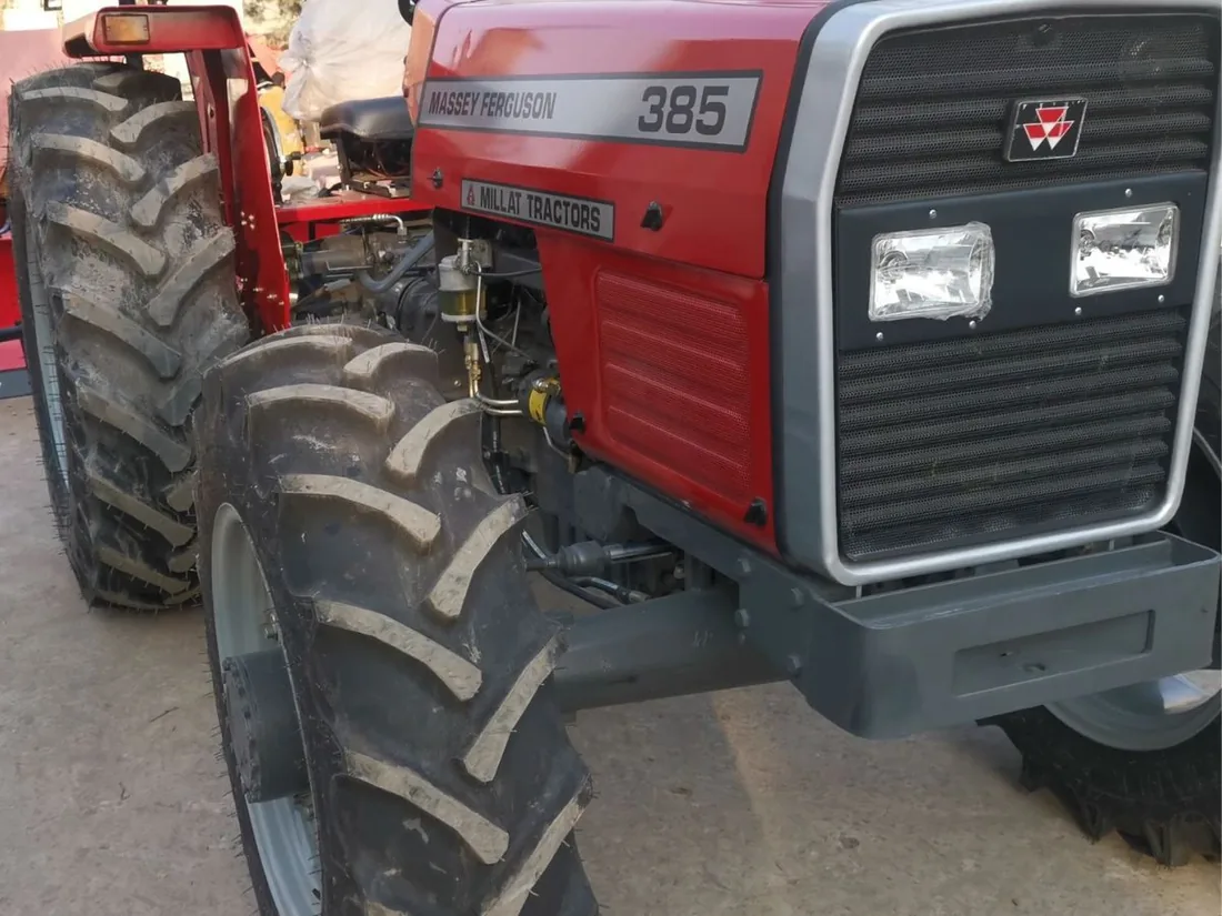 MF 385 4WD tractor showing treaded front tyres and grille